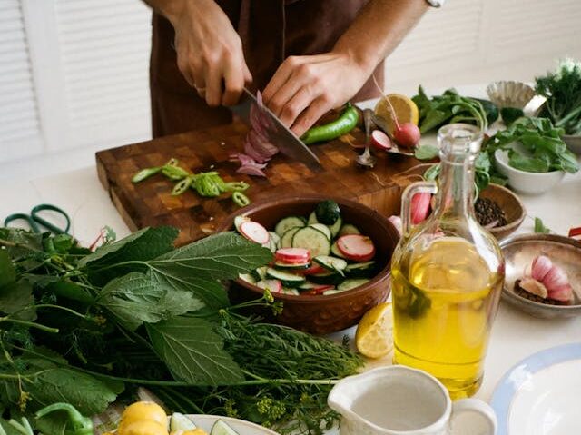 Kitchen Assistant Prepping Vegetables 