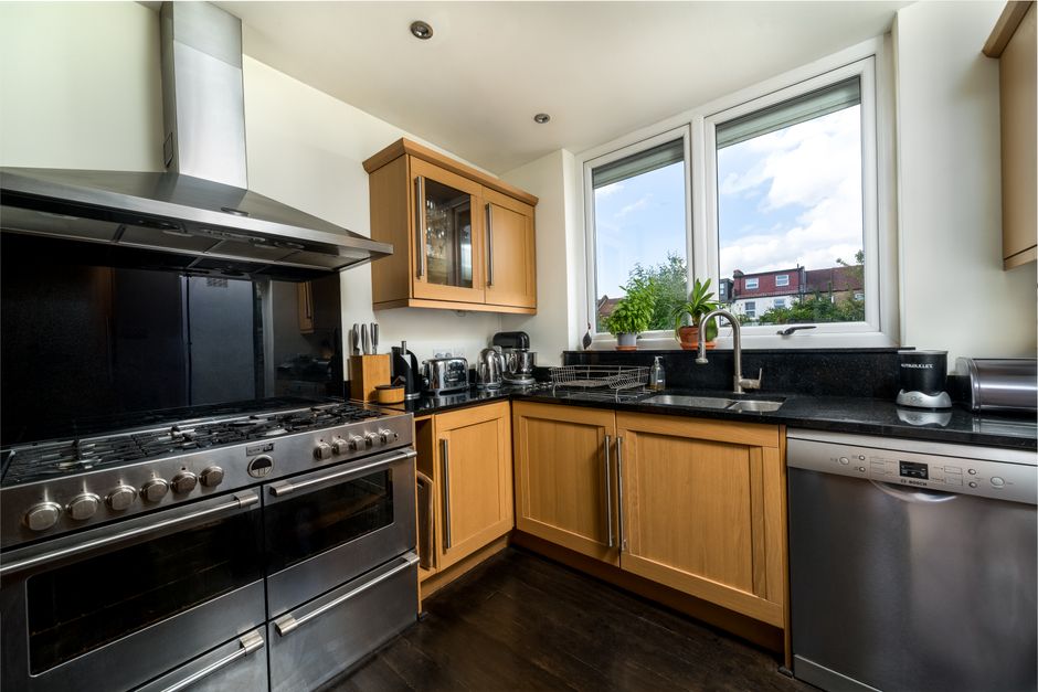 Care home commercial kitchen with professional equipment and staff